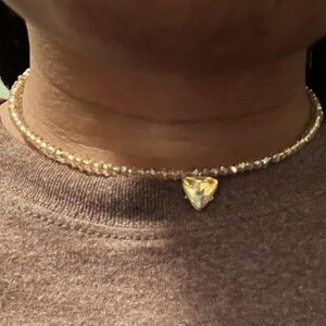 Rose gold choker necklace with a plated diamond